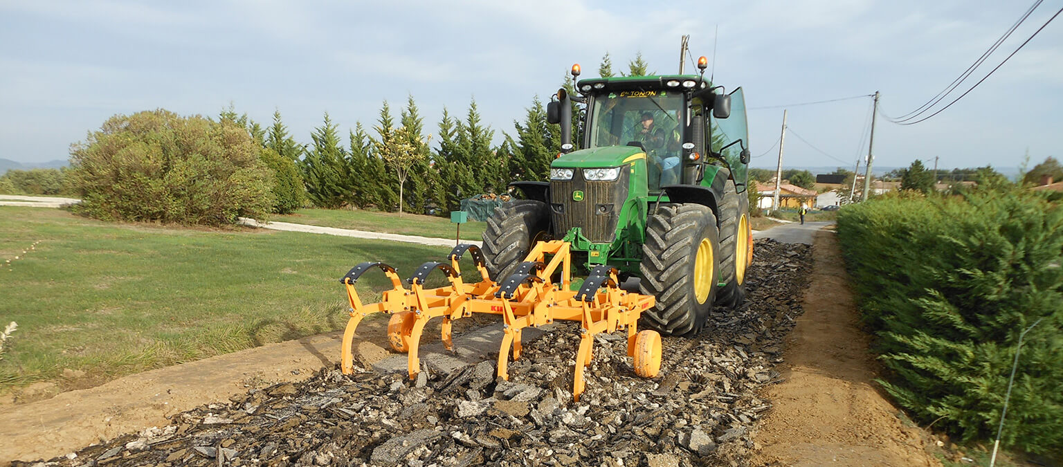 Ripping road with Kirpy ripper on front linkage john deere tractor